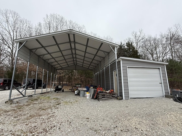 view of car parking with driveway and a carport