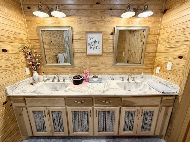 bathroom featuring a sink and double vanity