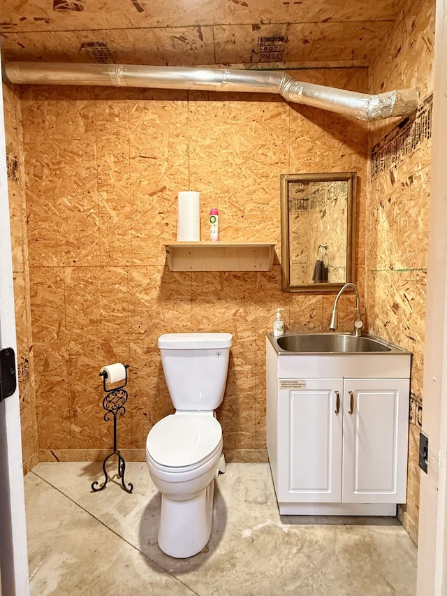 half bath with vanity and toilet