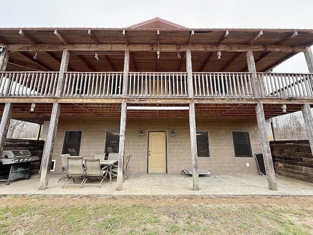 back of house with a patio