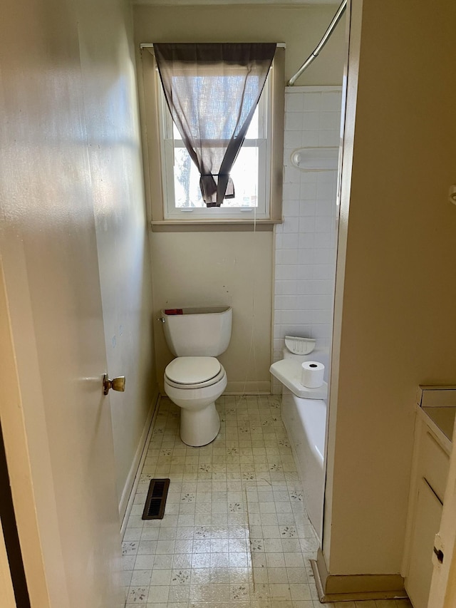 bathroom with toilet and separate shower and tub