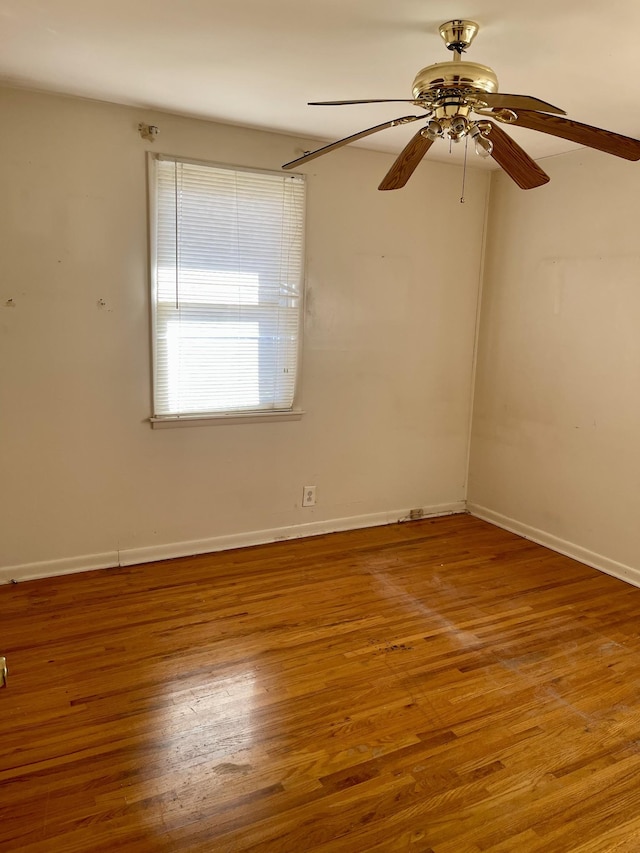 unfurnished room with hardwood / wood-style flooring and ceiling fan