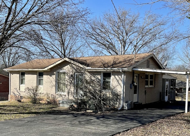 view of front of home with a carport