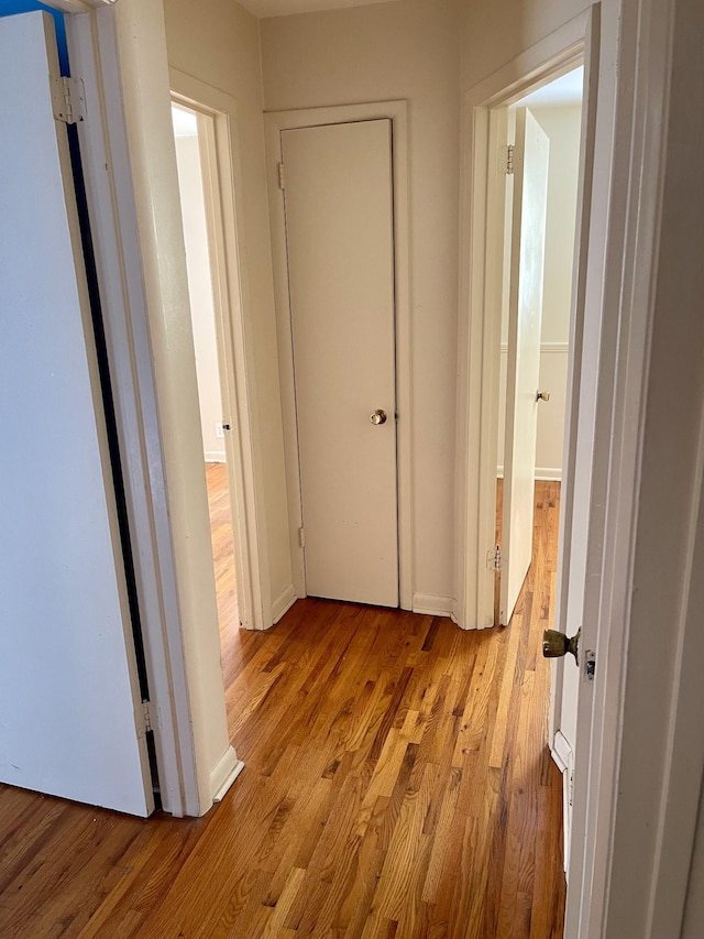 hallway featuring light hardwood / wood-style flooring