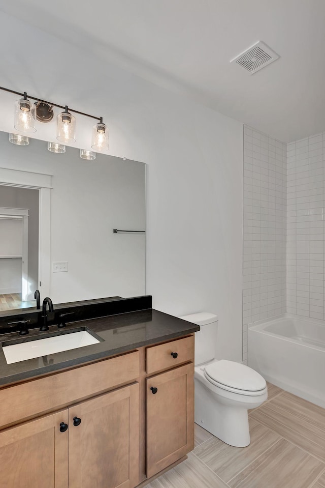 full bathroom with vanity,  shower combination, and toilet