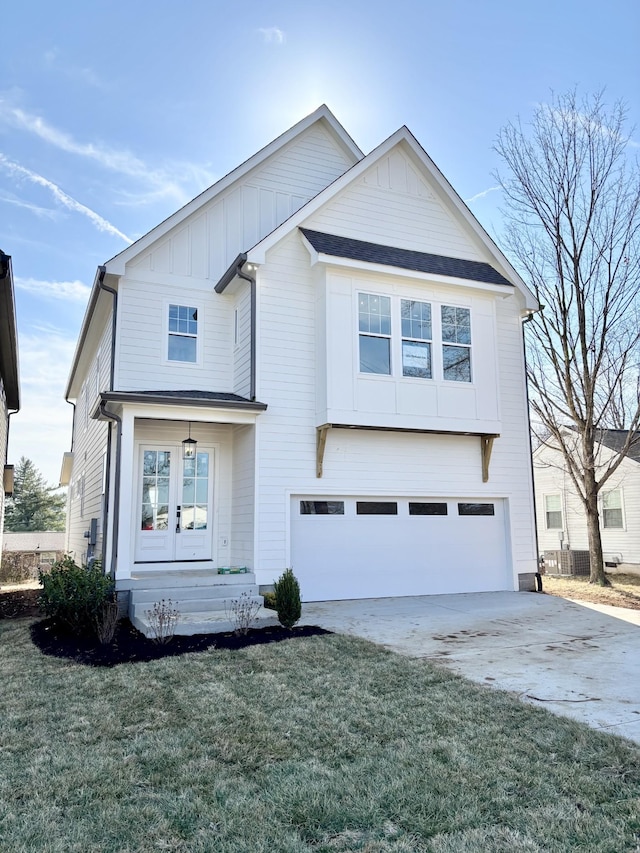 view of front of home with a garage and a front yard