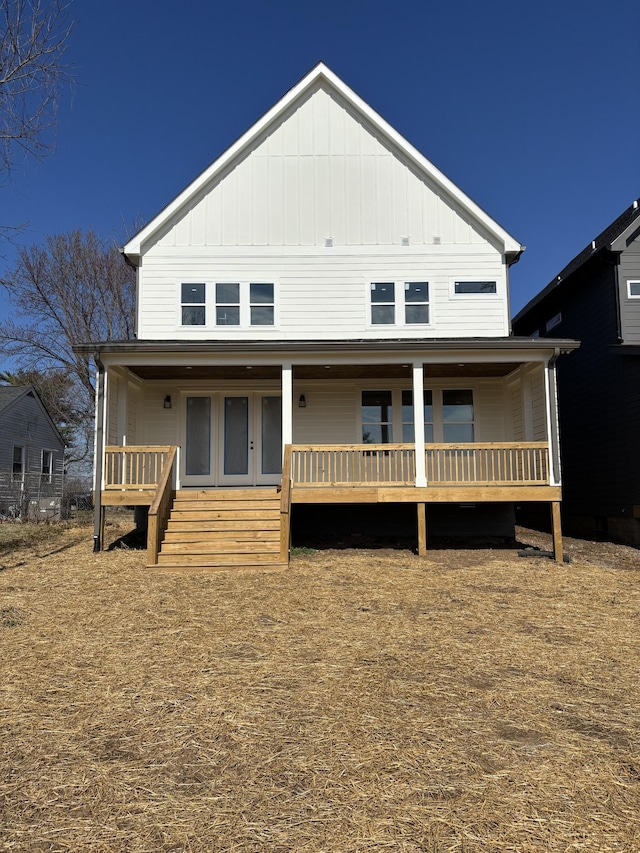 back of property with covered porch