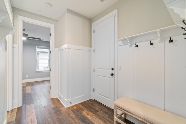 mudroom featuring dark wood-type flooring and ceiling fan