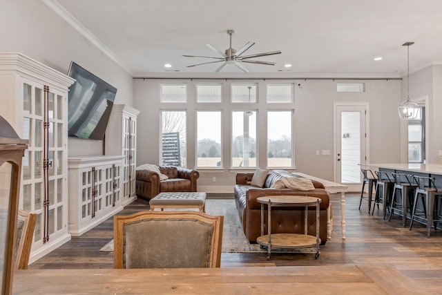 living room featuring hardwood / wood-style floors and ornamental molding