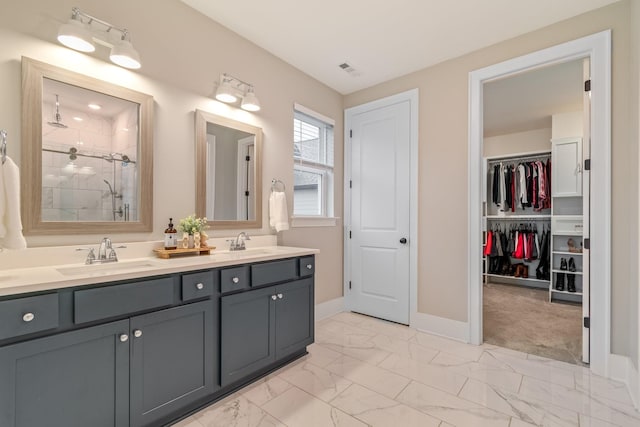 bathroom with vanity and a shower with shower door