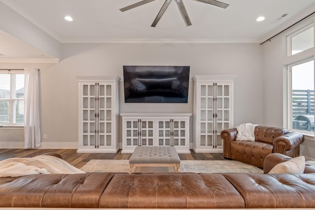 living room featuring crown molding, hardwood / wood-style floors, and ceiling fan