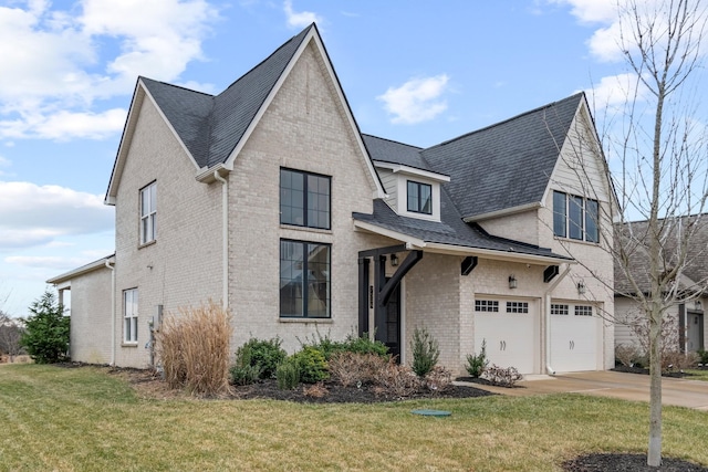 view of front of home with a garage and a front lawn