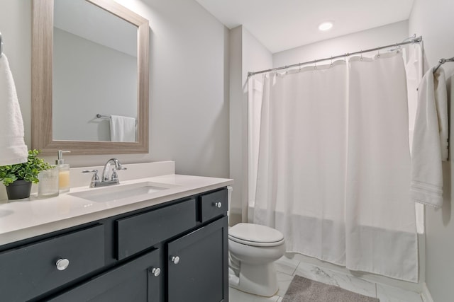 full bathroom featuring shower / bathtub combination with curtain, vanity, and toilet