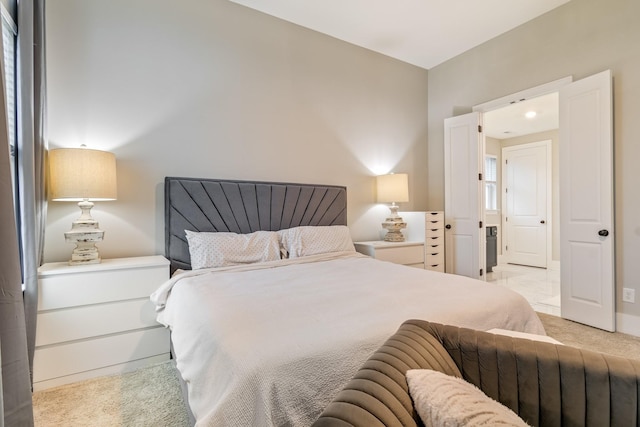 bedroom featuring light colored carpet