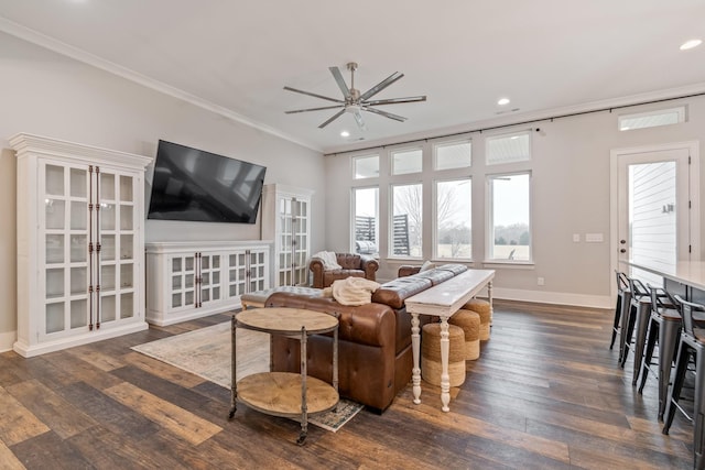 living room featuring ceiling fan, ornamental molding, and dark hardwood / wood-style flooring