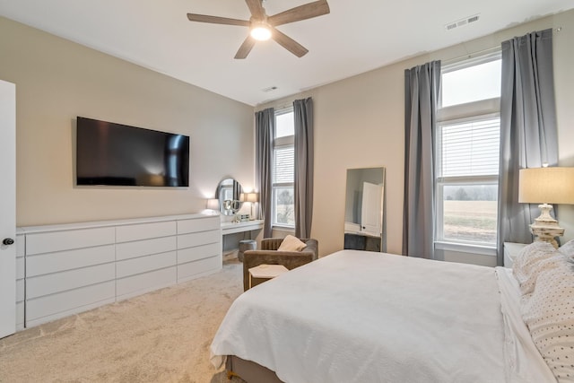 bedroom with ceiling fan and carpet floors