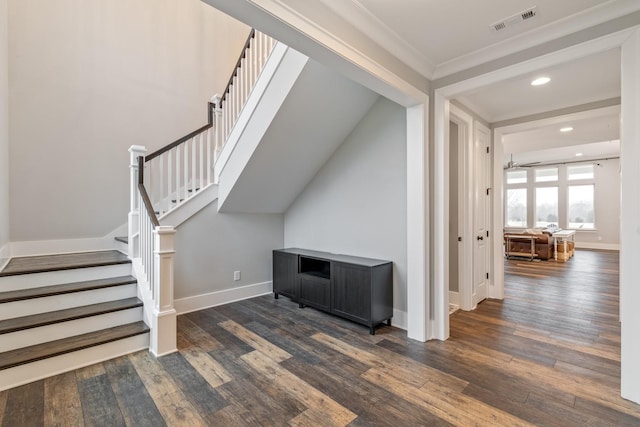 stairway with crown molding and hardwood / wood-style flooring