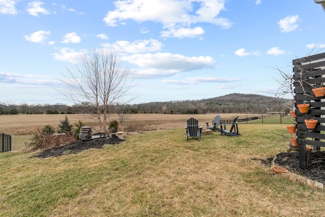 view of yard with a rural view