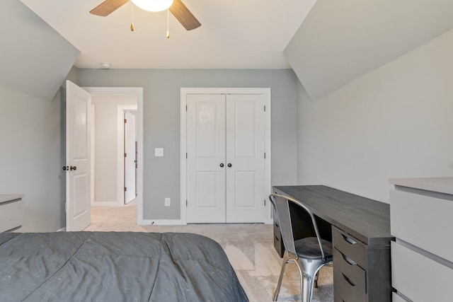 carpeted bedroom featuring a closet and ceiling fan