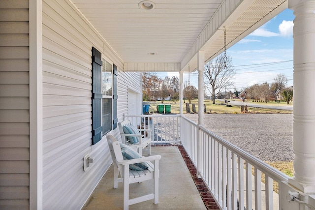 view of patio / terrace with a garage and covered porch