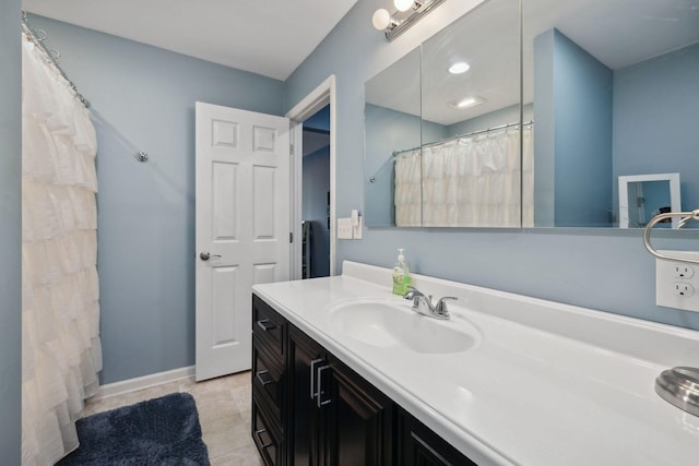 bathroom featuring tile patterned flooring and vanity