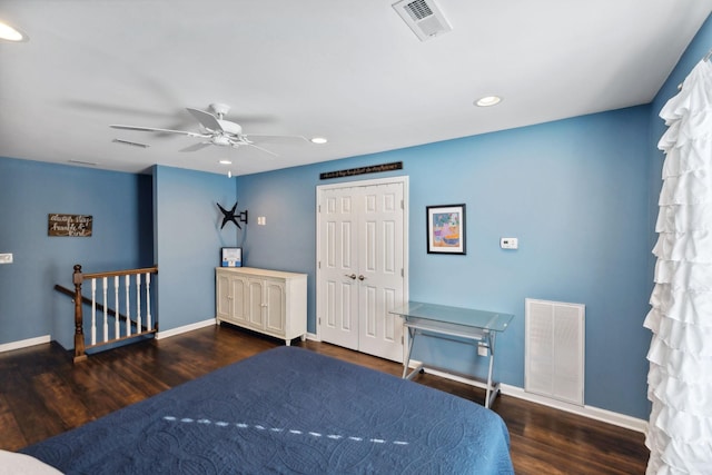 bedroom with ceiling fan, dark hardwood / wood-style flooring, and a closet