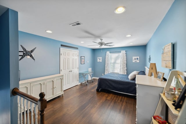 bedroom with ceiling fan and dark hardwood / wood-style floors