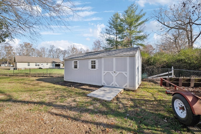 view of outdoor structure featuring a lawn