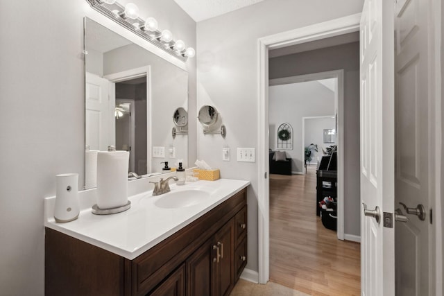 bathroom with vanity and hardwood / wood-style flooring