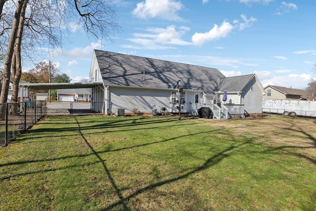 back of property featuring a lawn