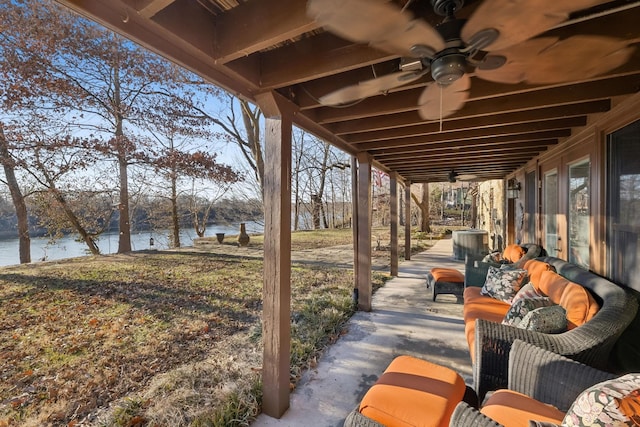 view of patio / terrace with a water view, ceiling fan, and an outdoor hangout area