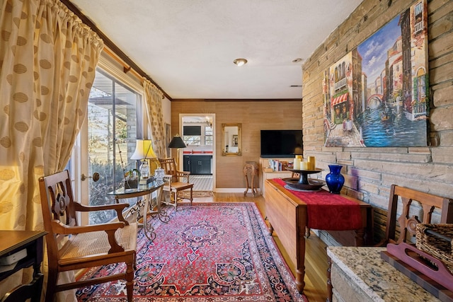 interior space featuring hardwood / wood-style floors and ornamental molding