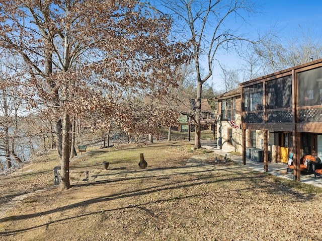 view of yard with a sunroom