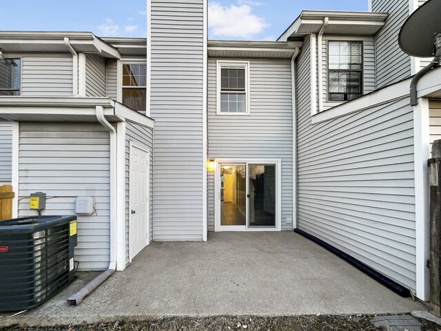 back of house with a patio and central air condition unit