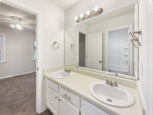 bathroom with vanity, ceiling fan, and shower / bathing tub combination