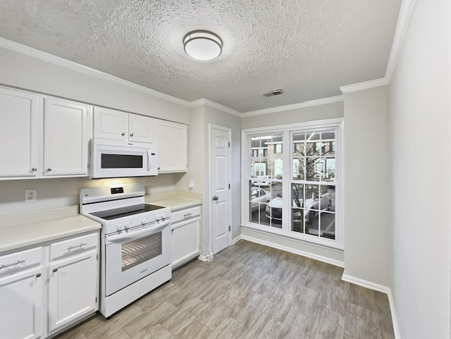 kitchen with white cabinetry, white appliances, ornamental molding, and a textured ceiling