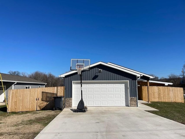 view of property exterior featuring a garage and a lawn