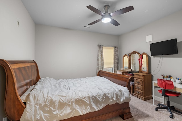 bedroom featuring light colored carpet and ceiling fan