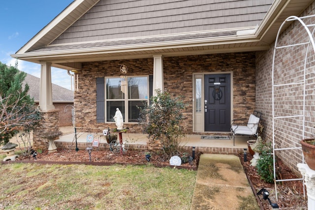 doorway to property featuring covered porch