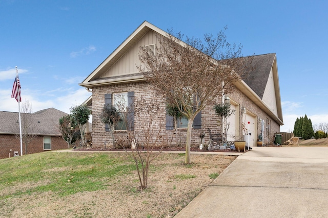 view of front of house with a garage and a front lawn