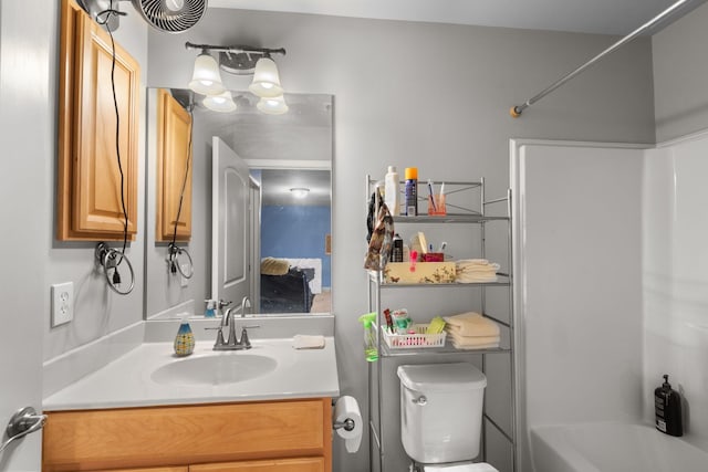 full bathroom with shower / tub combination, vanity, and toilet