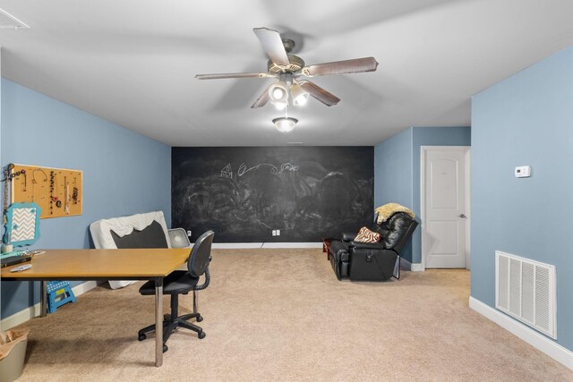 office space with light colored carpet and ceiling fan