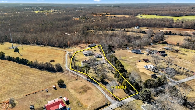 birds eye view of property featuring a rural view