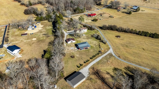 birds eye view of property with a rural view