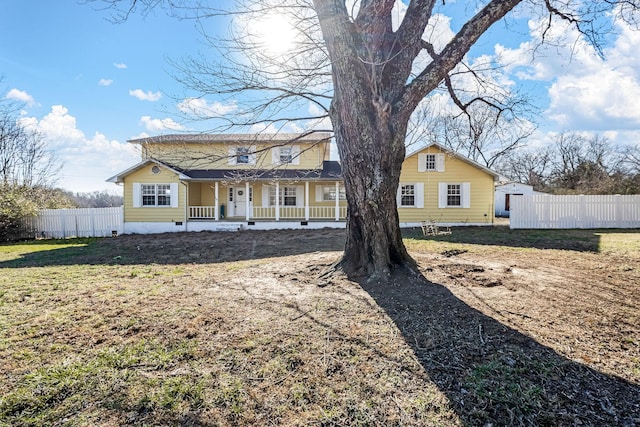 view of front of home featuring a porch and a front yard