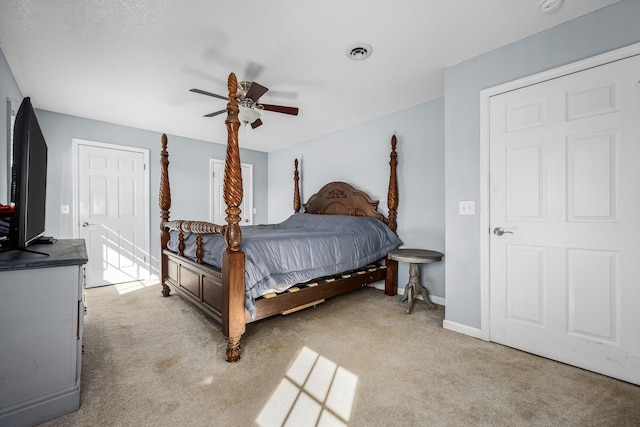 carpeted bedroom with ceiling fan