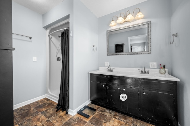 bathroom with vanity and walk in shower