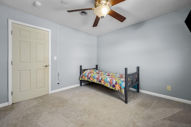 carpeted bedroom featuring ceiling fan