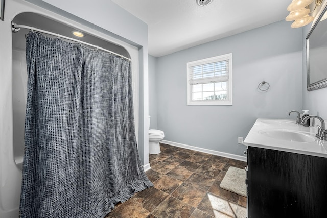 bathroom with vanity, toilet, and a shower with shower curtain