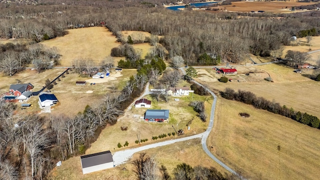 birds eye view of property with a rural view